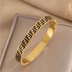 Gold Bracelet with Black Accents, beautiful design style. Perfect gift